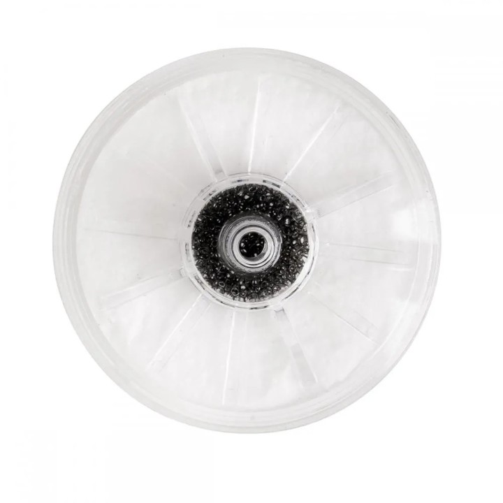 Filtrul 79-5516 văzut de pe cealaltă parte, cu materialul filtrant granular în jurul racordului central